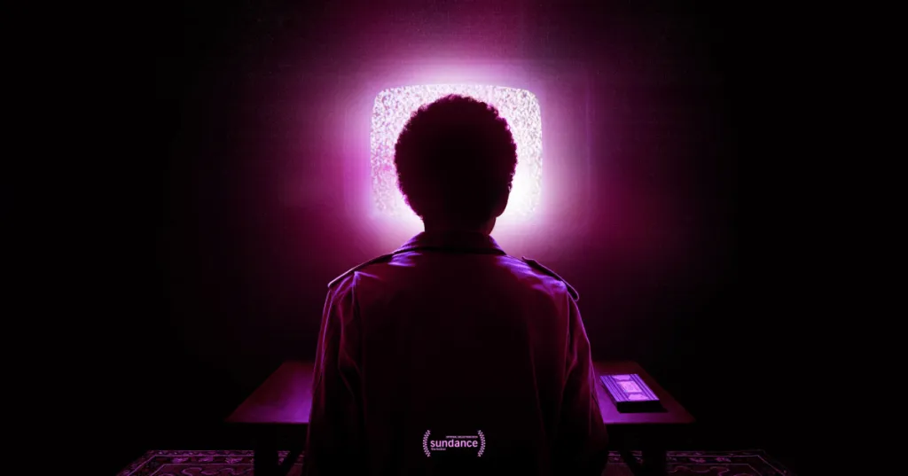 Image of a character staring at a television with static on the screen that's emitting a soft purple glow 